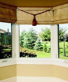 Bay windows in a yellow house
