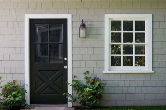 Exterior door with a window beside