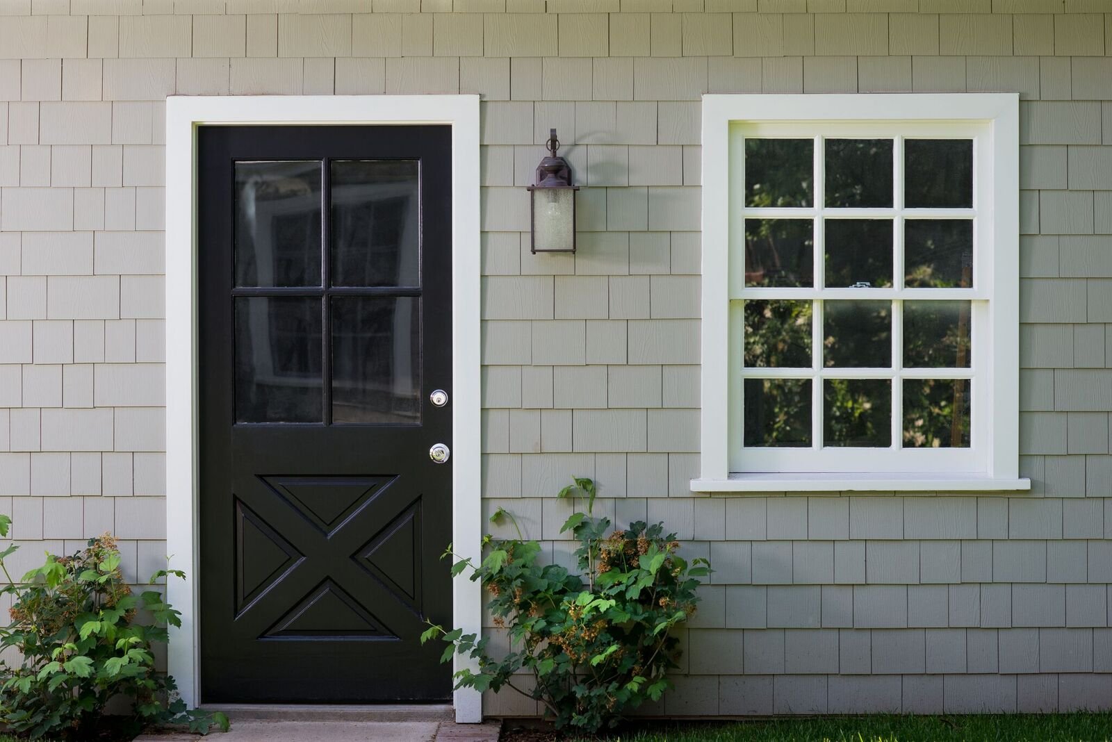 Exterior door with a window beside