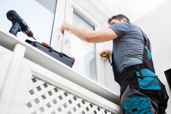 Man measuring windows