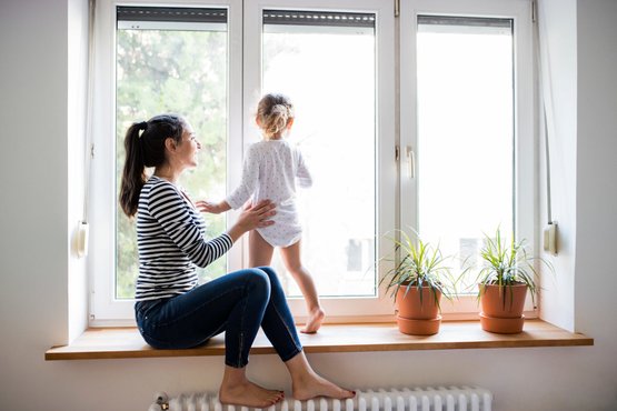Mother and child infront of a vinyl window