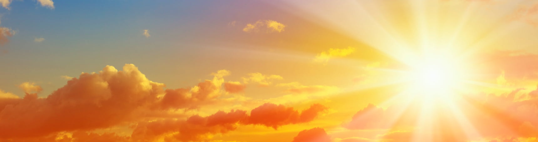 Picture of a bright sun on a partly cloudy day